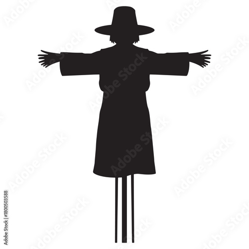 Silhouette of a scarecrow with outstretched arms and a wide brim hat