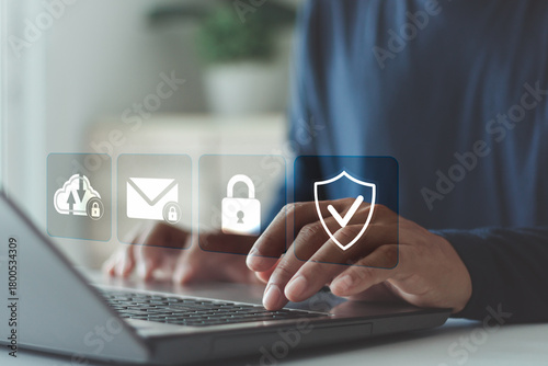 Cyber insurance, insurance that protect your business from cyber threats. Privacy data protection from hacker crime technology. Businessman using laptop with cyber security icon on virtual screen.