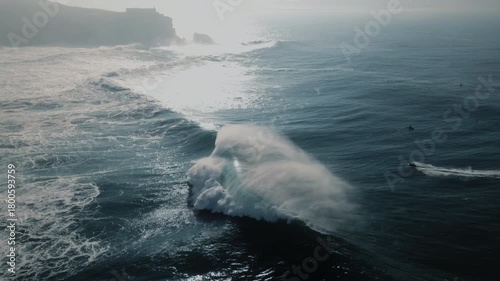 Surfers ride massive waves at Nazare Portugal's breathtaking sea