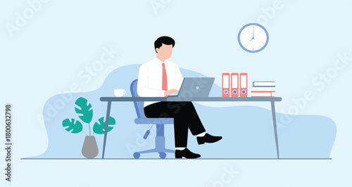 Man working on laptop at desk with binders and plant office