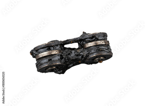 Dirty heavily greased used automotive roller chain mechanism close up maintenance