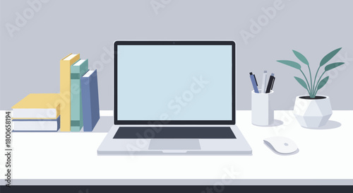 Minimalist workspace setup featuring a laptop books plant and stationery for productivity and design