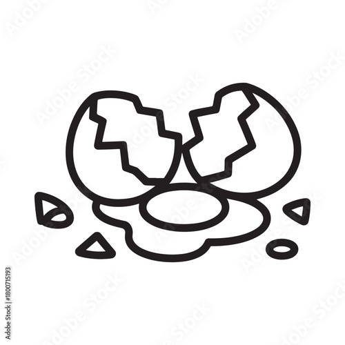 Cracked egg with yolk and shell fragments