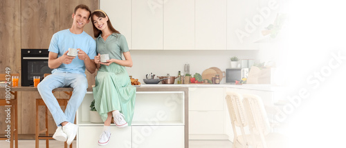 Young couple with cups of c...
