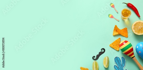 Different Mexican symbols on turquoise background with space for text