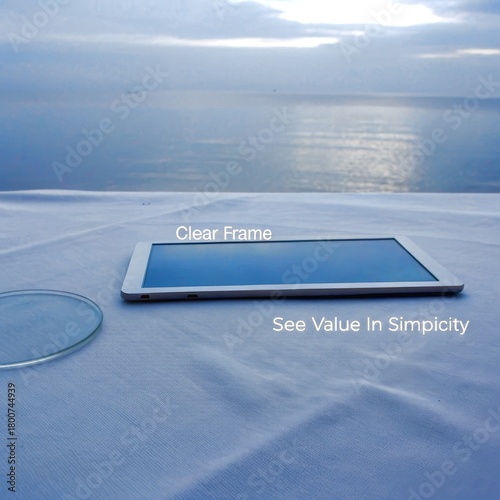 Tablet and Glass on Cloth with Sea Background