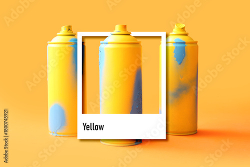 Spray paint cans on orange ...