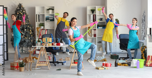 Happy janitors cleaning in ...