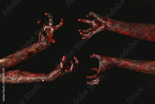 Many hands of zombies on bl...