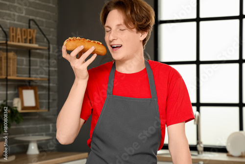 Young happy man with tasty ...
