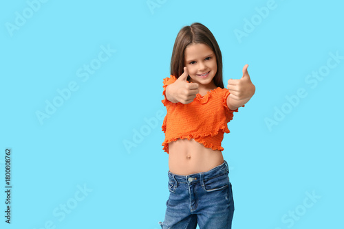 Portrait of happy little gi...