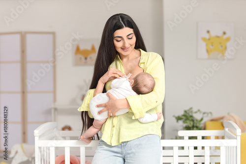 Woman breastfeeding her bab...