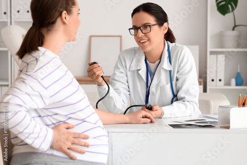 Female doctor measuring pre...