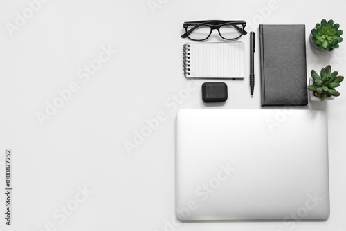 Laptop with earphones, note...