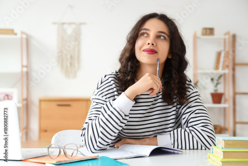 Thoughtful female Indian st...
