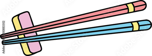 Pink and Blue Chopsticks Resting On a Holder With Yellow Trim and Pink Accent