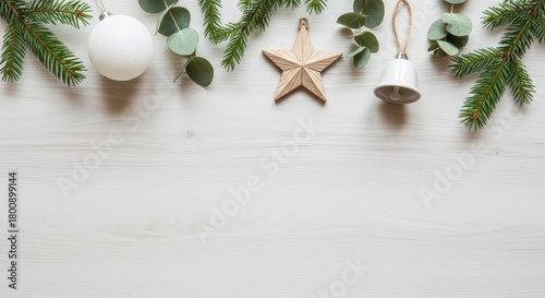 Christmas Border Fir Branches, Ornaments, Star, Bell on White Wood Background