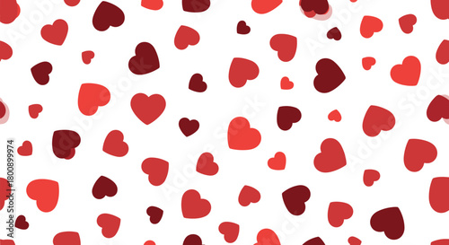 A cheerful seamless pattern with scattered red and deep red hearts of various sizes on a crisp white background, perfect for expressing love and romance.