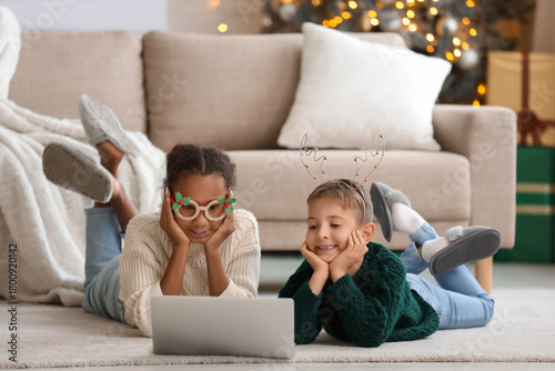 Cute children watching Chri...