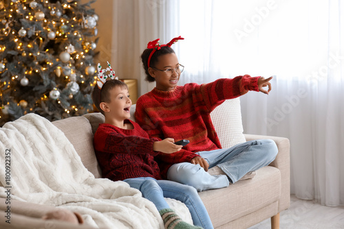 Cute children watching Chri...
