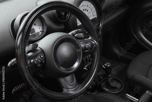 View of black steering whee...