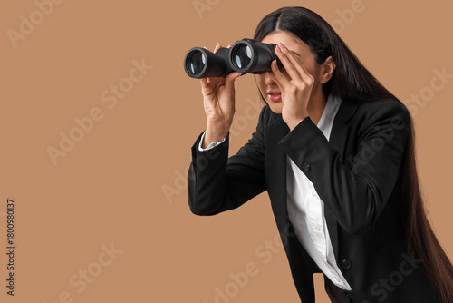 Young businesswoman looking...
