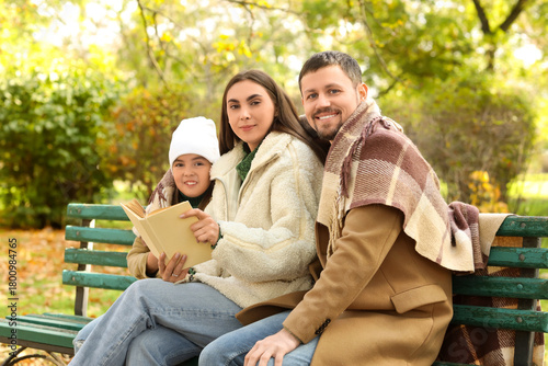 Happy family with warm plai...
