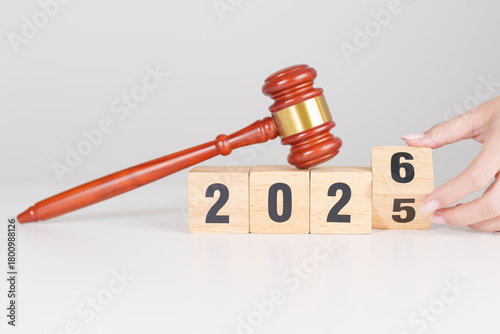 2025 end year to Happy New Year 2026 with judge gavel on table. Law, lawyer, judgment, justice auction and bidding concept