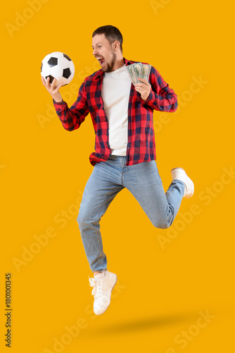 Happy young man with soccer...