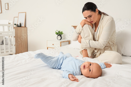 Young mother with her baby ...
