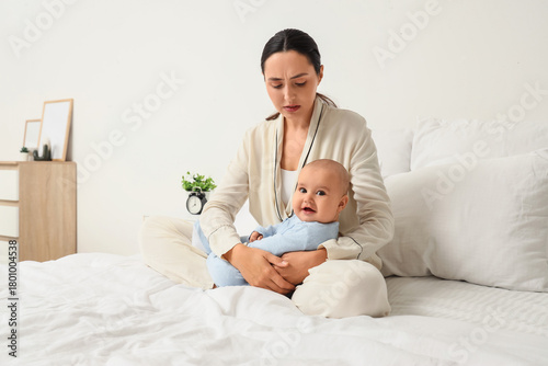 Young mother with her baby ...