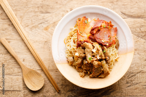 Egg Noodles with meat in bowl with chopsticks