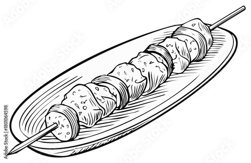 Grilled meat and vegetables on skewer served on a plate