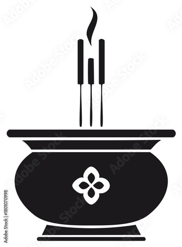 Incense sticks burning in a decorative pot with smoke rising upwards symbolizing spirituality