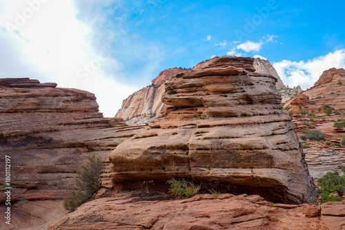 Photography Rounded sandstone formations stand against bright desert sky, highlighting the textured rock layers near Angel’s Landing in Zion National Park