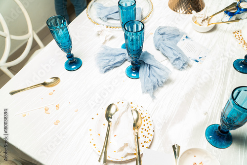 Wedding reception table aftermath reflecting party's end