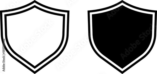 Two simple shield icons one outline one solid black
