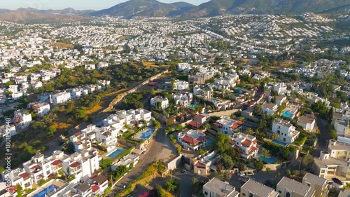 Bodrum, Turkey. Aerial view of Halicarnassus ancient city walls with white houses, green trees and hills in Bodrum historical area.. Aerial View
