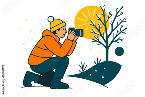 Frozen Photography Scene. Frozen forest shot. A person crouches in the snow to photograph frosty branches