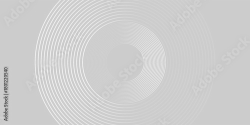 Abstract image composed of multiple layered circles on a light grey background.