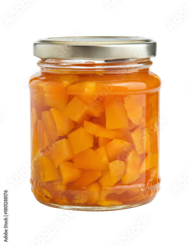 jar of preserved mango pieces on white background.