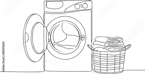 Open washing machine and laundry basket with folded clothes