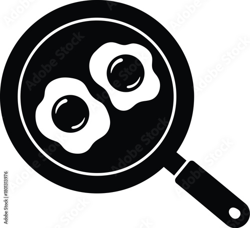 Black and white illustration of a frying pan with two fried eggs inside