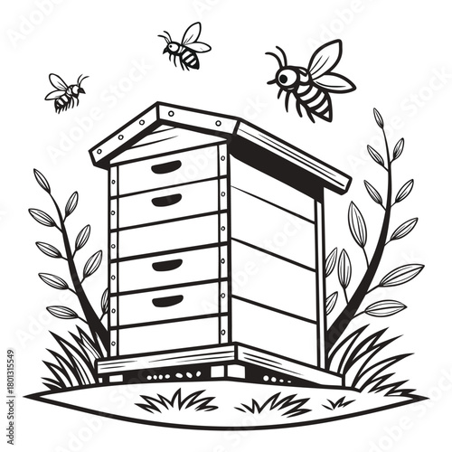 Bees hover around a black and white wooden beehive surrounded by plants