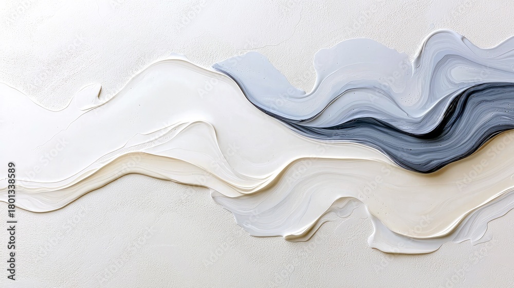Fototapeta premium A close-up view of textured paint strokes in shades of white, cream, and grey, forming abstract wavy patterns.