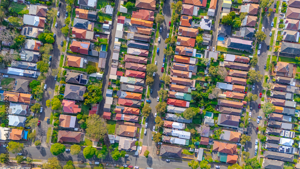 Obraz premium Aerial Panorama Drone View of a inner western Sydney Suburb of Ashbury Urban Sprawl and the terracotta roof tops streets and trees of Suburban Sydney NSW Australia