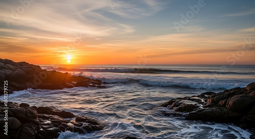 Golden Hour Ocean Sunset Waves Crashing on Rocky Shore with Serene Coastal View.