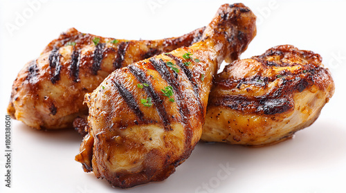 grilled chicken drumsticks with barbecue seasoning on a white background