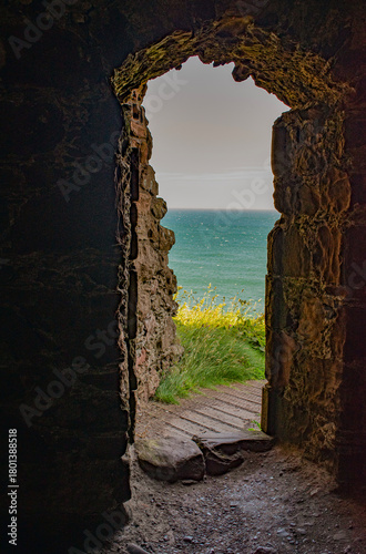 Stonehaven, Scotland, United Kingdom: the North Sea seen from an opening of an ancient building of Dunnottar Castle, a ruined medieval fortress on a rocky headland in the northeast coast
