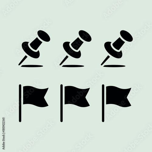 Set of black silhouette push pins and flags on a light green background